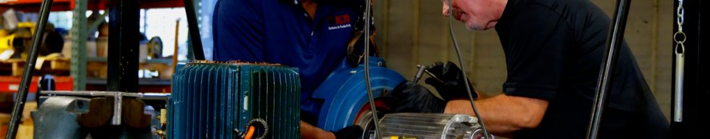 Technicians disassembling an escalator gear motor from DTW airport